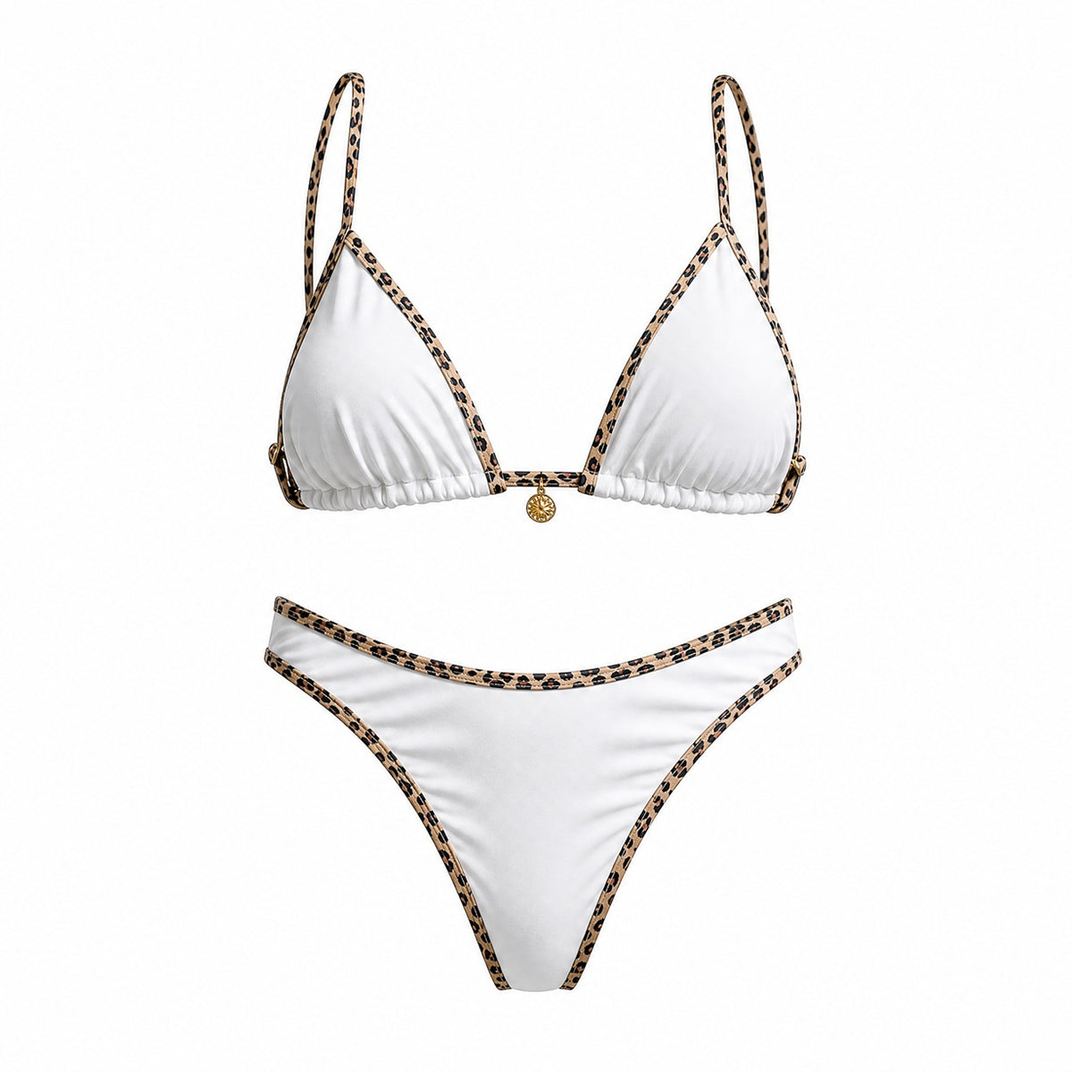 Flat lay of the Alessandra bikini set in black, white, and cream featuring leopard print contrast piping and a gold sun charm detail.