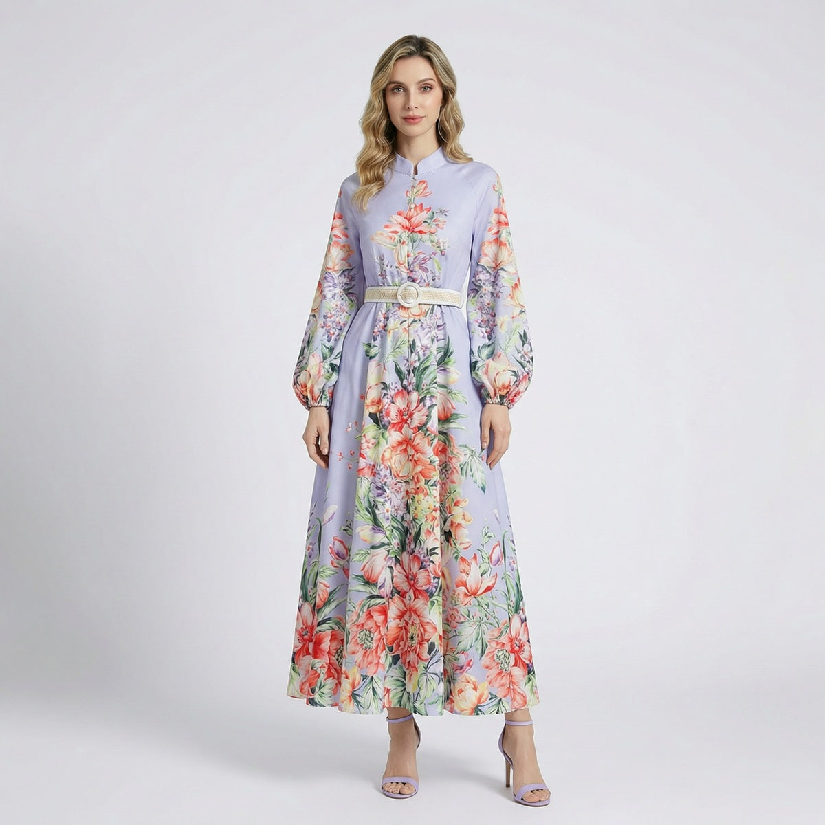Front view of Annie floral print maxi dress in lavender and white colors with lantern sleeves and waist belt.