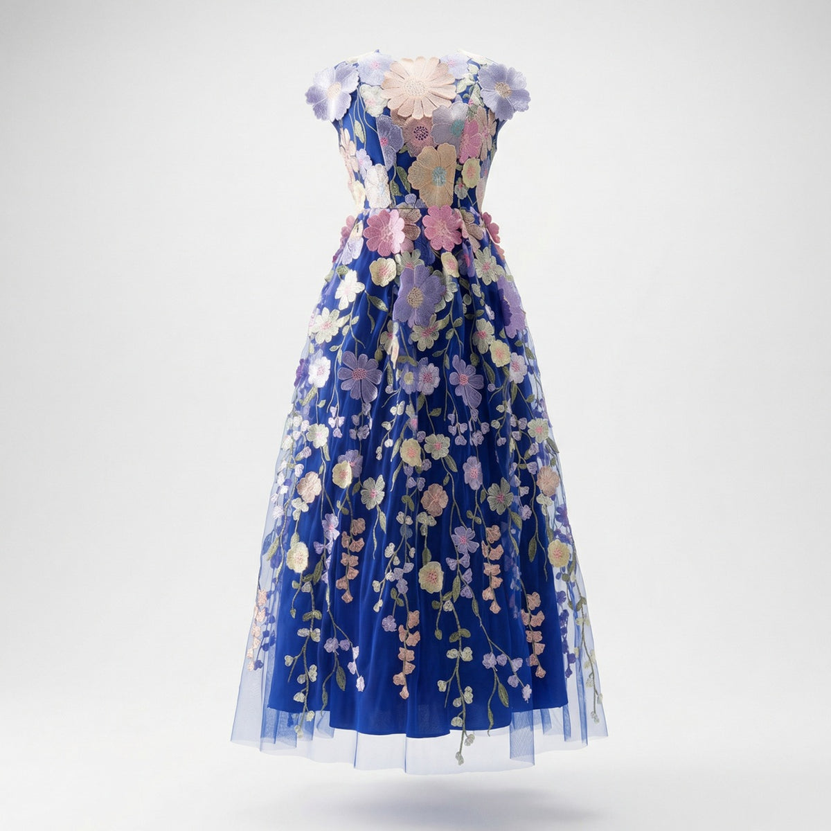 Close up of Arlete blue midi dress with 3D floral embroidery and mesh fabric.