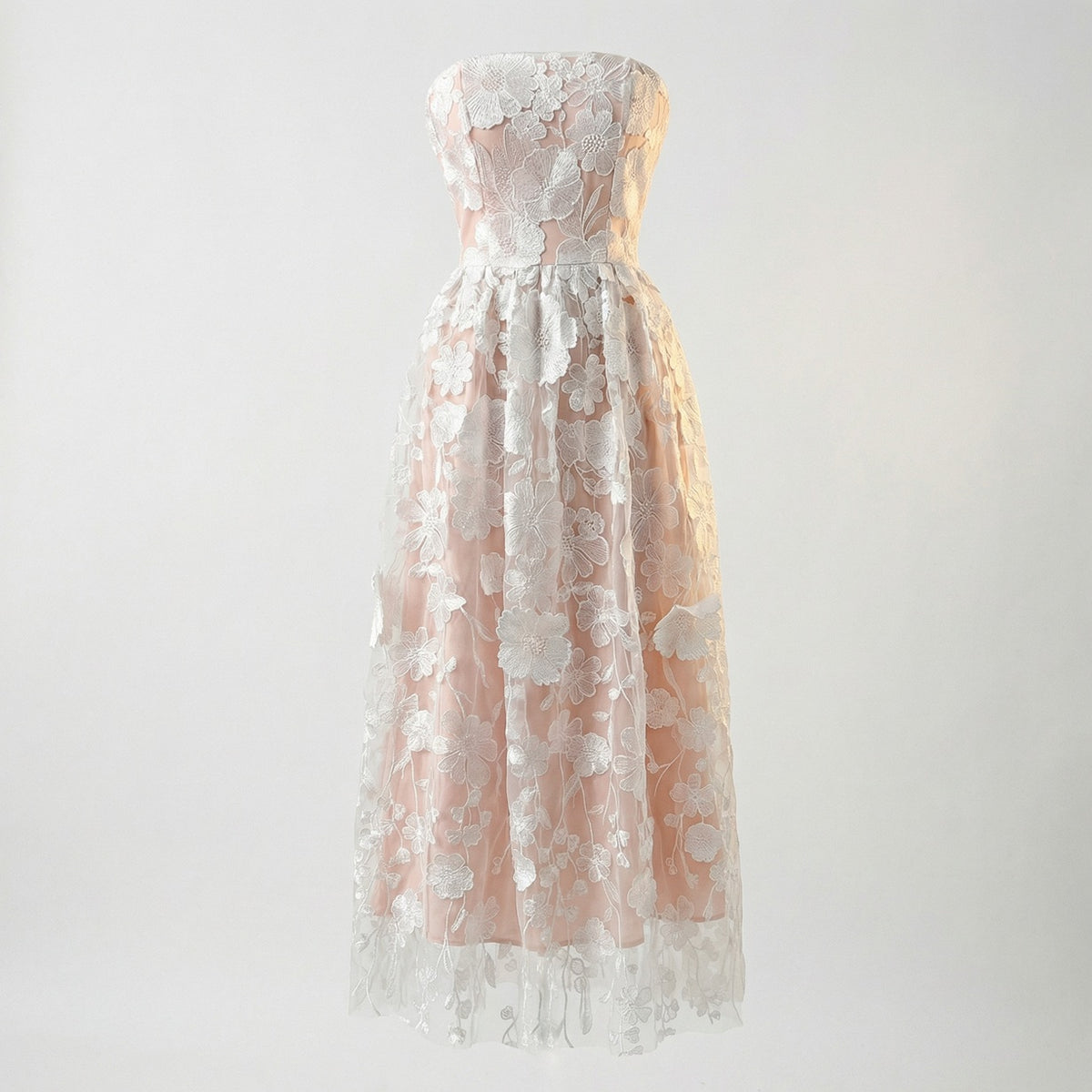 White Arlete strapless midi dress with pink lining and white floral embroidery.