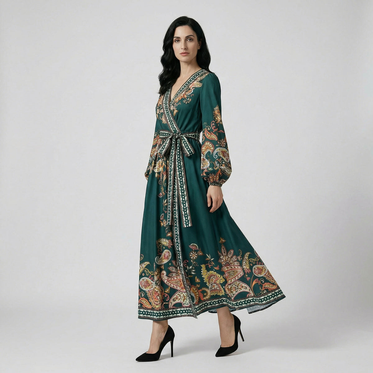 Danelle wrap maxi dress in emerald green with paisley print and lantern sleeves.