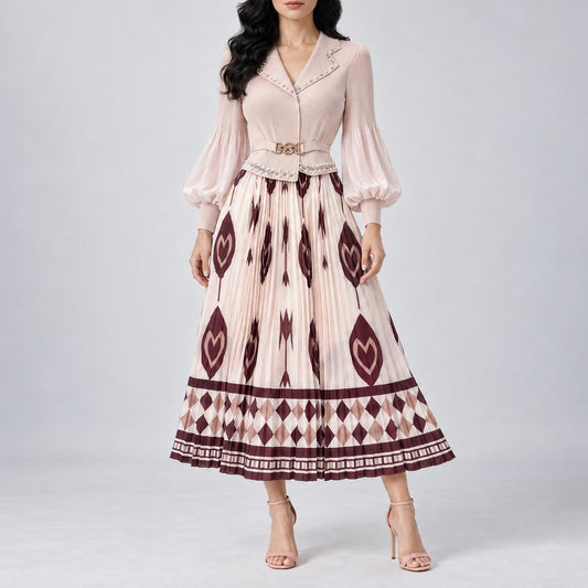 sleeve midi dress with a pleated skirt, featuring a cream base with dark burgundy geometric and ikat patterns, a matching belt, and a delicate embroidered neckline. Elegant pleated midi dress with a fitted bodice, belted waist, and patterned skirt