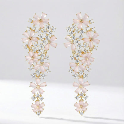 Pair of Eva long statement earrings with pink floral stones, crafted from copper, photographed on a clean studio background.
