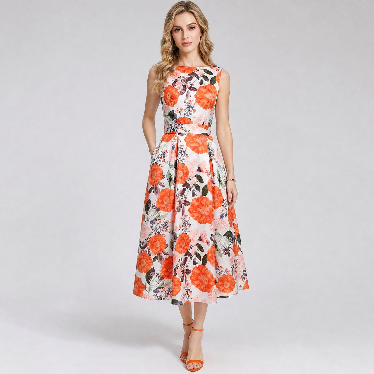 Gabia sleeveless midi dress in a vibrant pink and white floral pattern with a boat neck and pleated skirt midi dress featuring a rich orange floral and countrystyle leaf pattern on white fabric