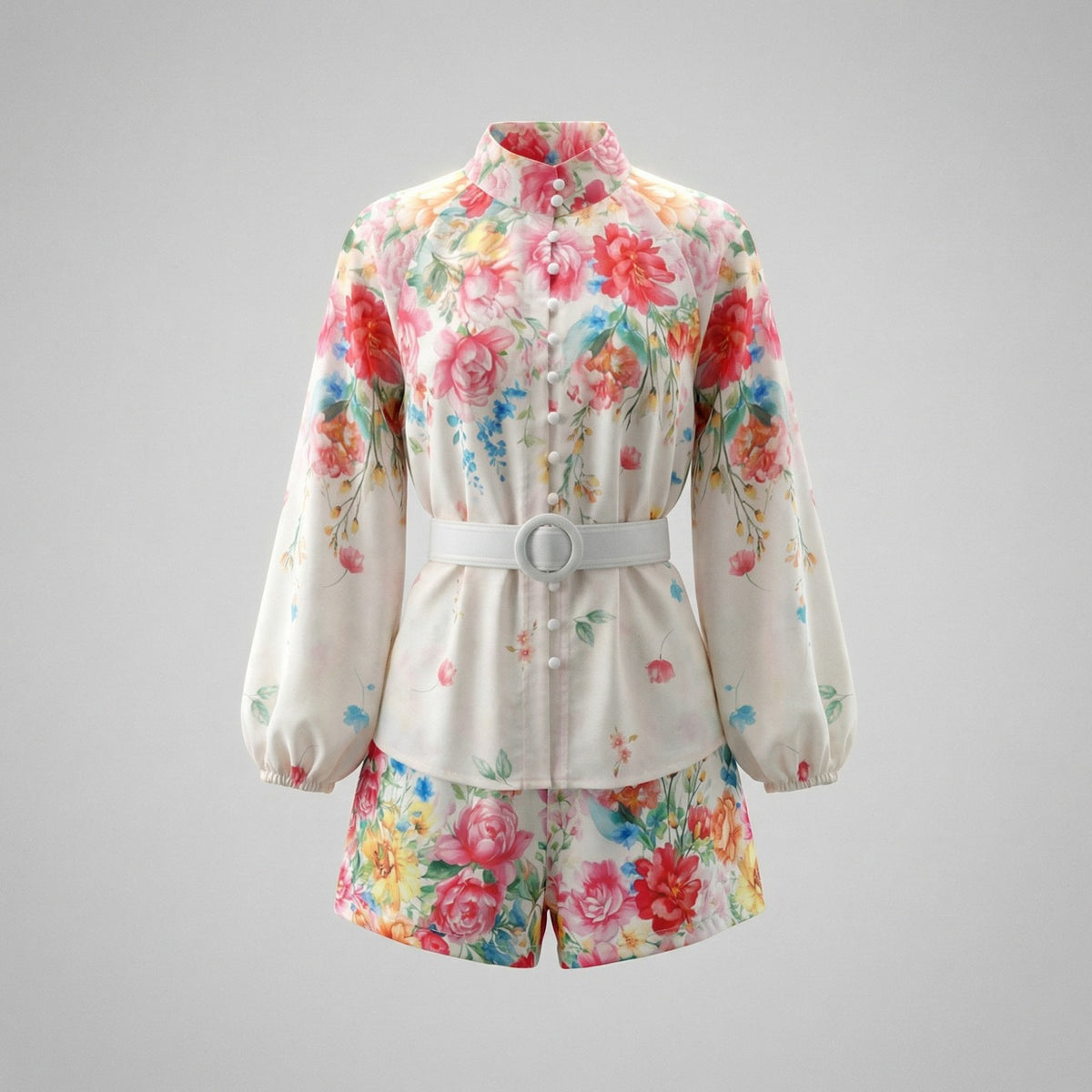 Genesis two-piece floral set with white floral lantern sleeve button-down shirt, matching high-waisted shorts, and circular buckle belt.