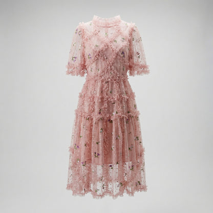 Front view of Graciane pink mini dress with floral embroidery and tiered ruffles