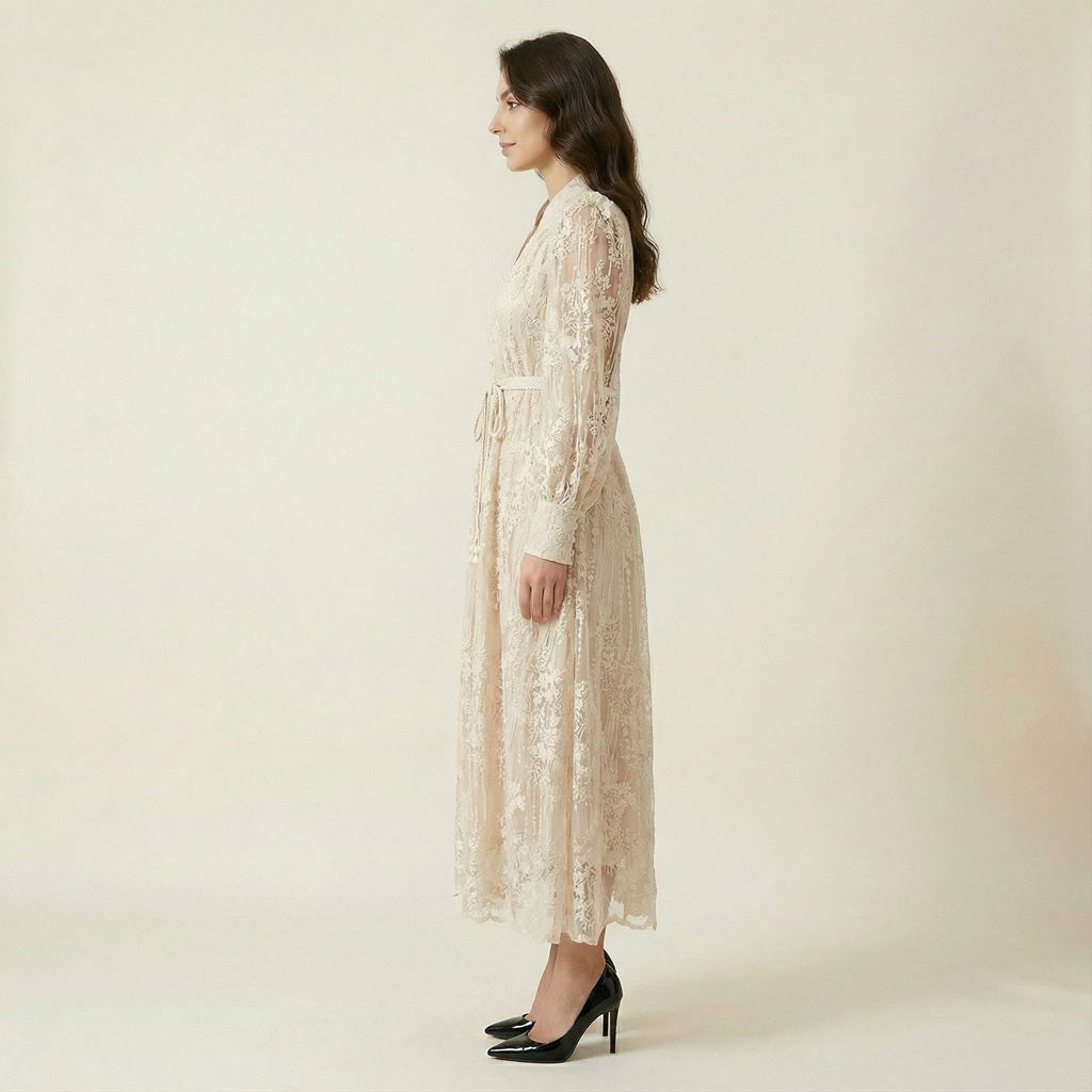 Hamida v-neck dress in emerald green featuring romantic lace long sleeves and faux pearl buttons.