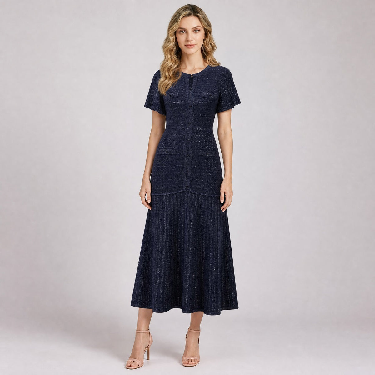 Ionna navy blue textured knit midi dress with flutter sleeves and button details.
Ionna dress, knit midi dress, versatile formal dress, short sleeve knit dress, one size dress FR, button down dress