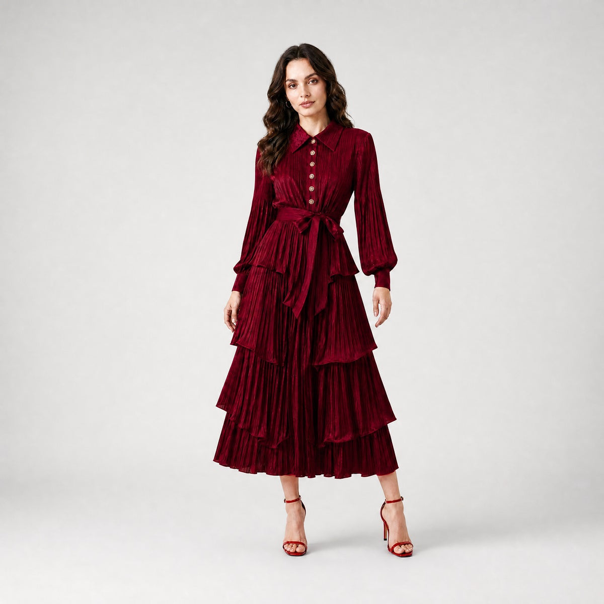 Julia Dress in burgundy, a long-sleeved pleated maxi dress with tiered ruffles and a waist tie.