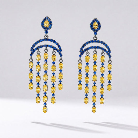 Pair of Leah geometric drop earrings featuring tiered blue and yellow cubic zirconia stones in a black gold setting.