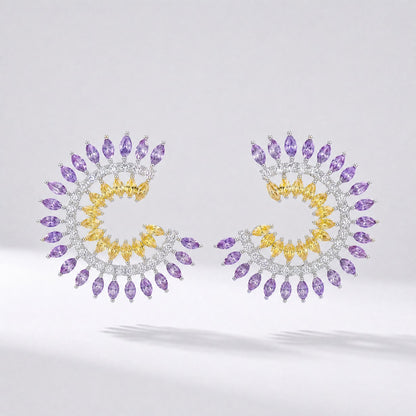 Pair of Leah spiral earrings in blue/green and purple/yellow color options featuring marquise cubic zirconia stones.
Leah earrings, spiral stud earrings, colorful cz earrings, marquise cut jewelry, statement studs, versatile formal earrings, cubic zirconia jewelry