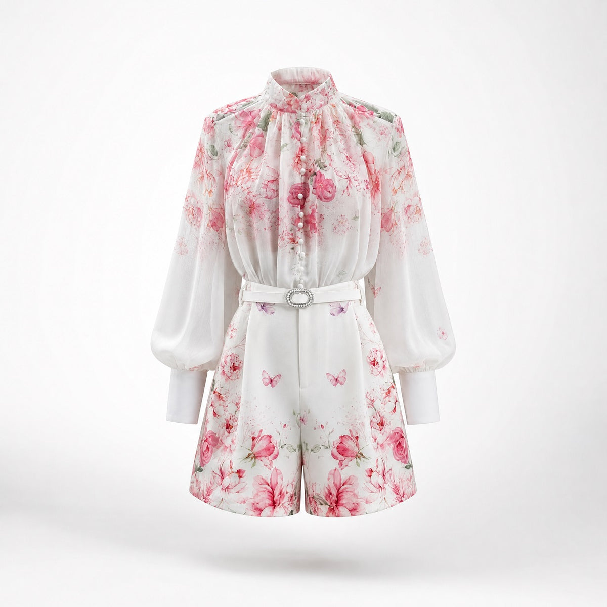 airy and delicate sheer pink chiffon blouse from the Linda Set, showcasing covered front loop buttons and a soft watercolor butterfly and floral pattern.