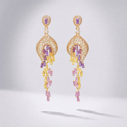 Lyana 7cm long tassel drop earrings with yellow, pink, and lilac baguette-cut cubic zirconia stones on yellow gold metal.
