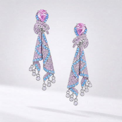 Mara luxury long dangle earrings featuring pink pear-cut cubic zirconia and turquoise accents in a silver water drop design.
