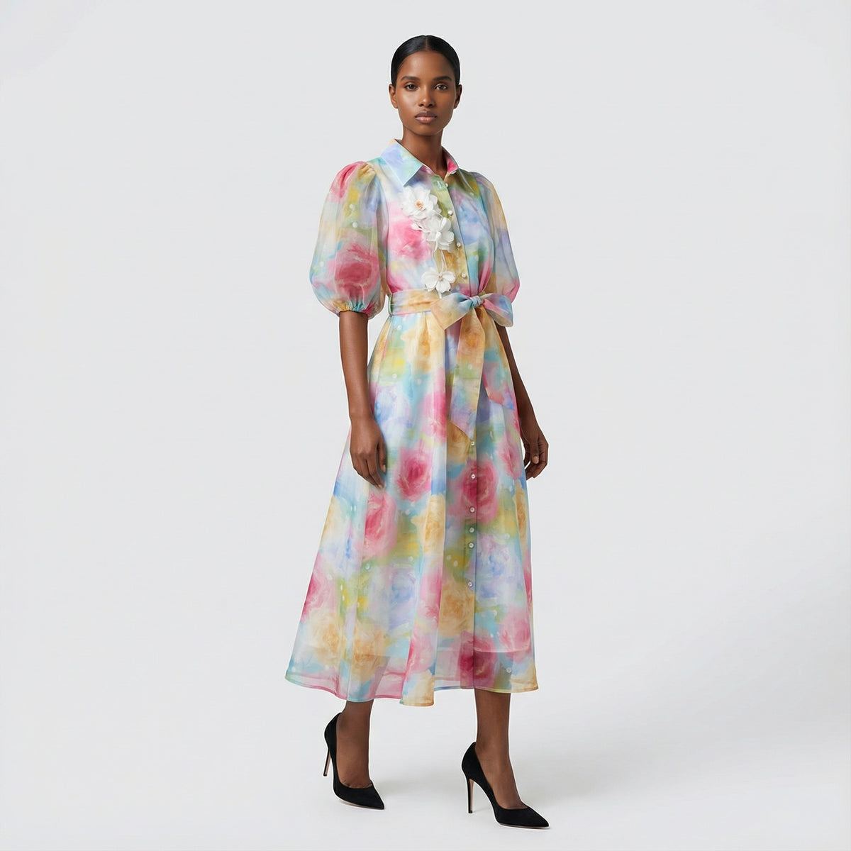 The Marie maxi dress in a 145 cm length featuring a long-sleeved ribbed knit bodice and a dramatic side-pleated accordion skirt with a matching waist belt.