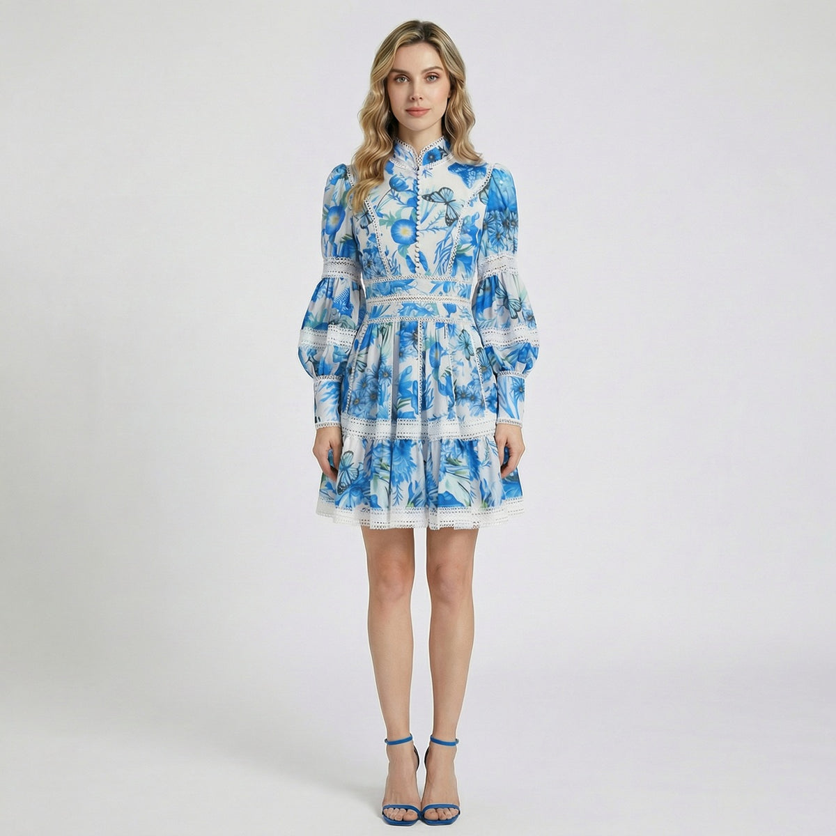 Marina Mini Dress in Azure Blue Butterfly print with lantern sleeves and lace trim.