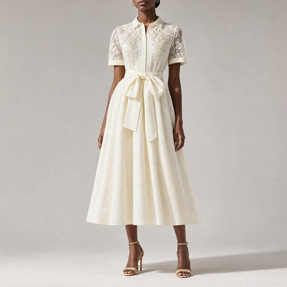 Marta dress bodice, highlighting the detailed floral lace overlays, sheer mesh collar, and dense clusters of hand-placed white faux pearls.pearl-beaded vintage dress in classic black, featuring short mesh lace sleeves and a statement wrap-around waist bow.pearl-embroidered mesh lace dress in beige, featuring a large waist bow, tailored collar, and matching vintage accessories.vintage A-line midi dress in beige, showing the sheer mesh paisley lace back yoke and a defined tie-waist band.