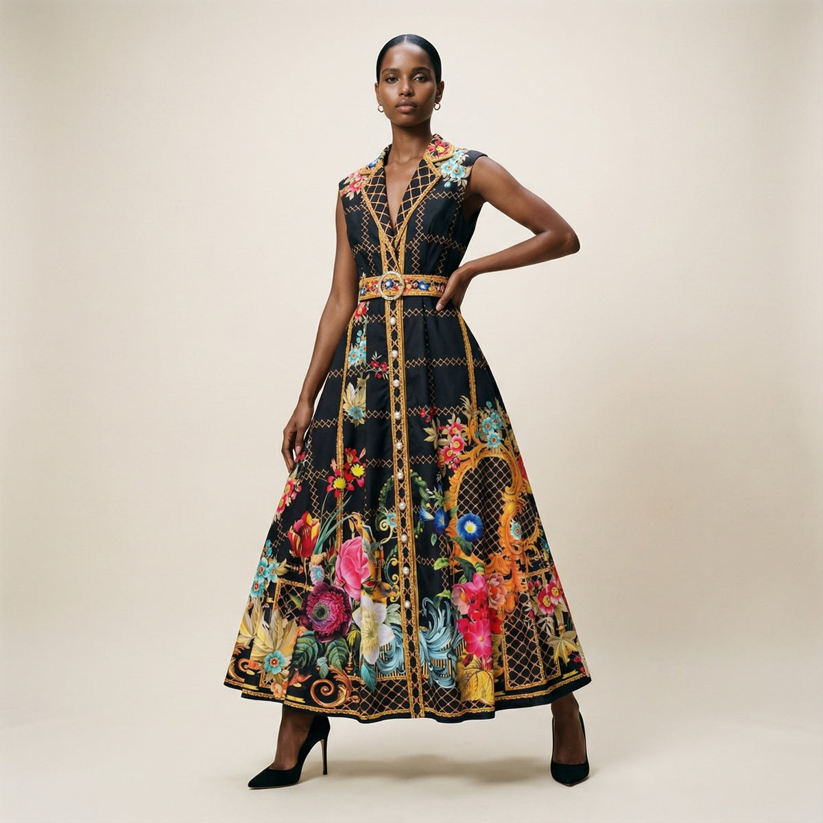 A model wearing the Martine black long-sleeved ribbed knit maxi dress featuring a side-pleated accordion skirt panel.