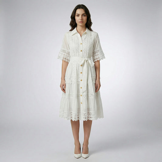 The Noora midi dress shown in black, white, sage green, and camel featuring intricate lace panels, gold buttons, and a matching belt.