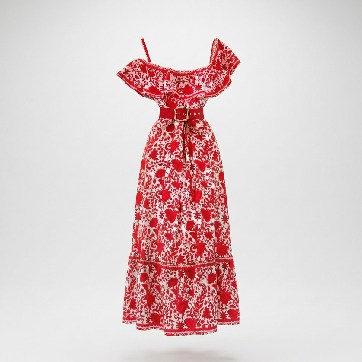 Front view of the Penelope dress, a red and white floral midi-maxi with a ruffled neckline and red belt
