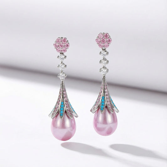 Pink teardrop earrings with large pearl, pink and blue cubic zirconia, and floral stud for elegant feminine look