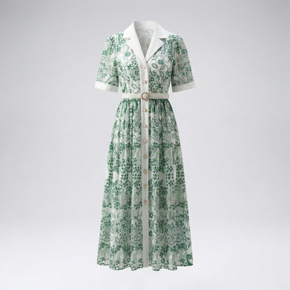 Kelly green Ruxandra floral lace shirt dress on a mannequin showing intricate embroidery and pearl button details.