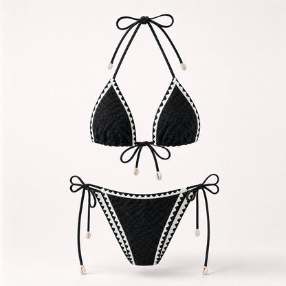 Classic black textured bikini with white zig-zag trim and shells.