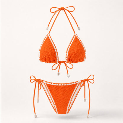 Sunset orange textured triangle swimsuit with white contrast border.