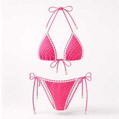 Bright pink popcorn fabric bikini set with cowrie shell accents.