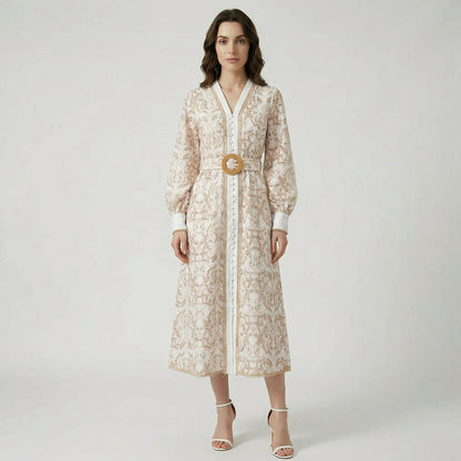 Tamara boho midi dress featuring white lace with tan embroidery, lantern sleeves, and a circular straw belt buckle.