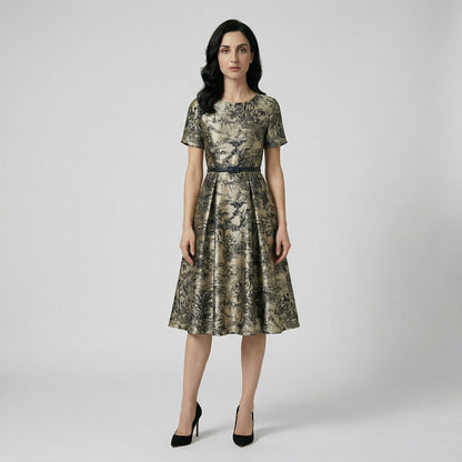 The Telma midi dress displayed on a hanger, featuring a grey and black landscape print, a 115cm length, and a black waist belt.