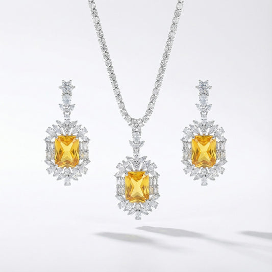 Yellow or emerald crystal drop necklace and earrings set with cubic zirconia rhinestones in silver color metal